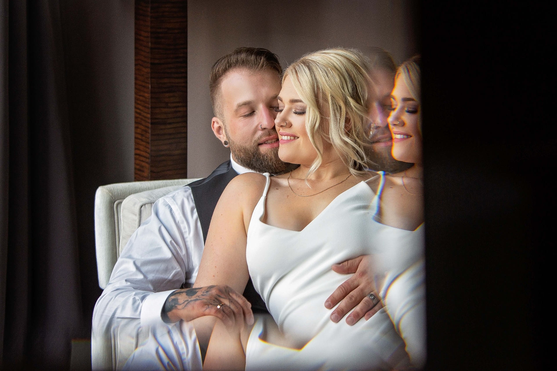 Elegant couple portrait by a window