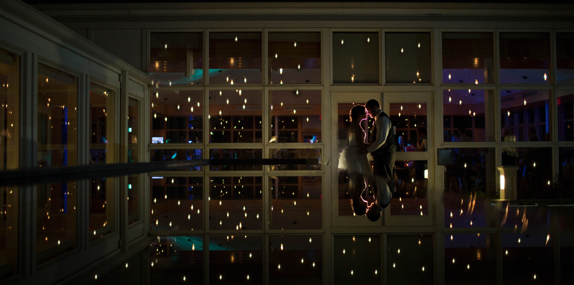 Couple in a city scene framed by flowing veil